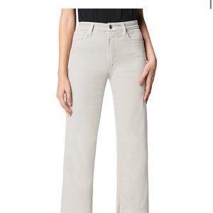 The Blake in Beach Sand is a high-rise white jean with wide legs and cut hems